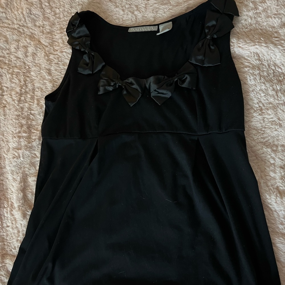 Cute black top with bows around collar